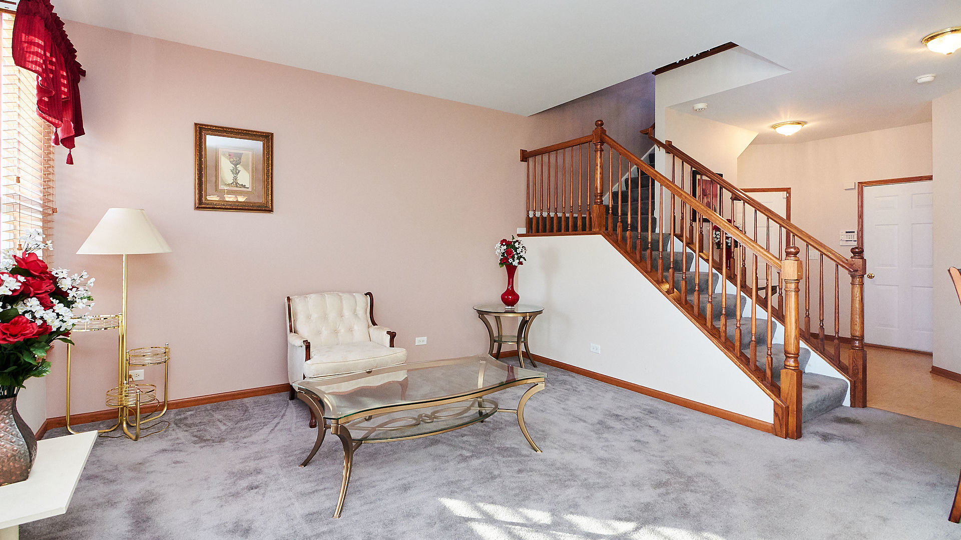 1989 West Cobblestone Road, Unit 1989 Romeoville, IL 60446 - Photo 8 of 51 a living room with stairs and furniture
