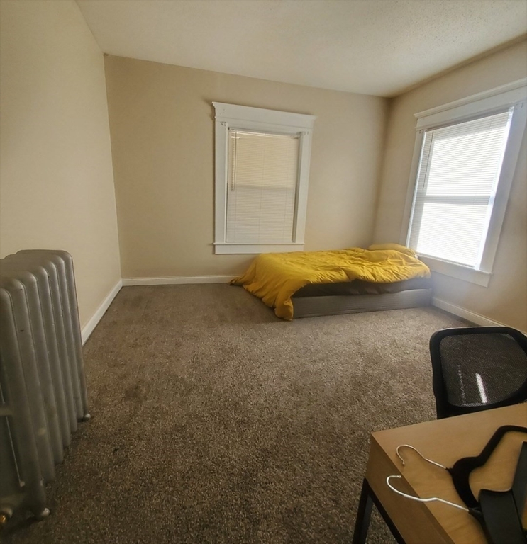 50 Hollywood Street, Unit 2 Springfield, MA 01108 - Photo 5 of 6 a bedroom with a bed and window