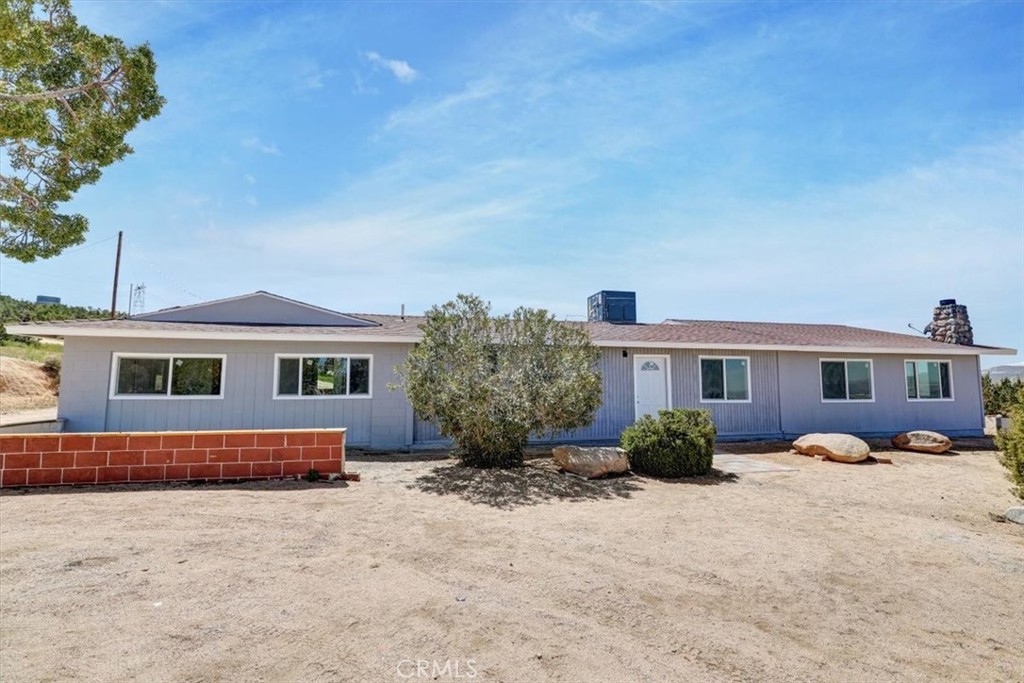 8433 Aspen Road Apple Valley, CA 92308 - Photo 1 of 1 a front view of a house with a yard