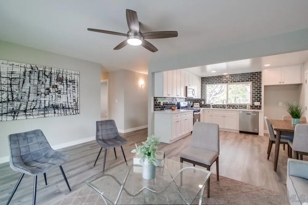 10110 Strathmore Drive Santee, CA 92071 - Photo 11 of 45 a living room with furniture kitchen view and a dining table