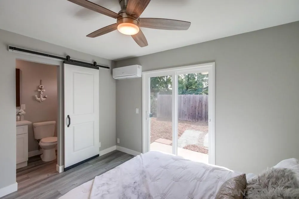 10110 Strathmore Drive Santee, CA 92071 - Photo 18 of 45 a bedroom with a bed and a window