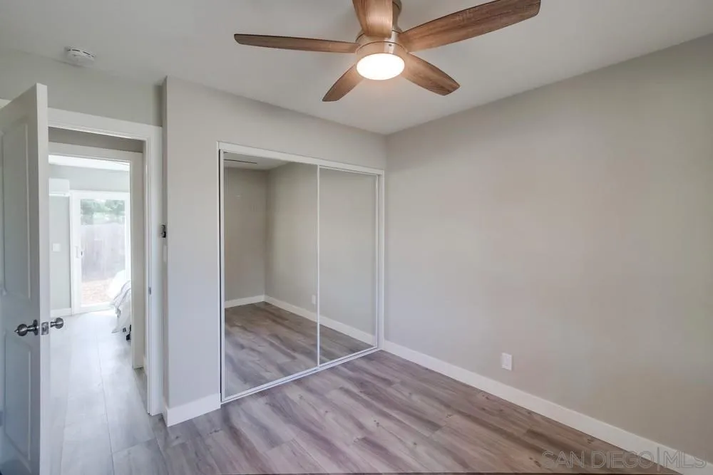 10110 Strathmore Drive Santee, CA 92071 - Photo 26 of 45 an empty room with closet and a ceiling fan