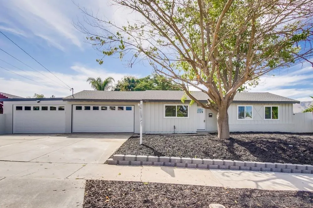 10110 Strathmore Drive Santee, CA 92071 - Photo 4 of 45 a front view of a house with a yard