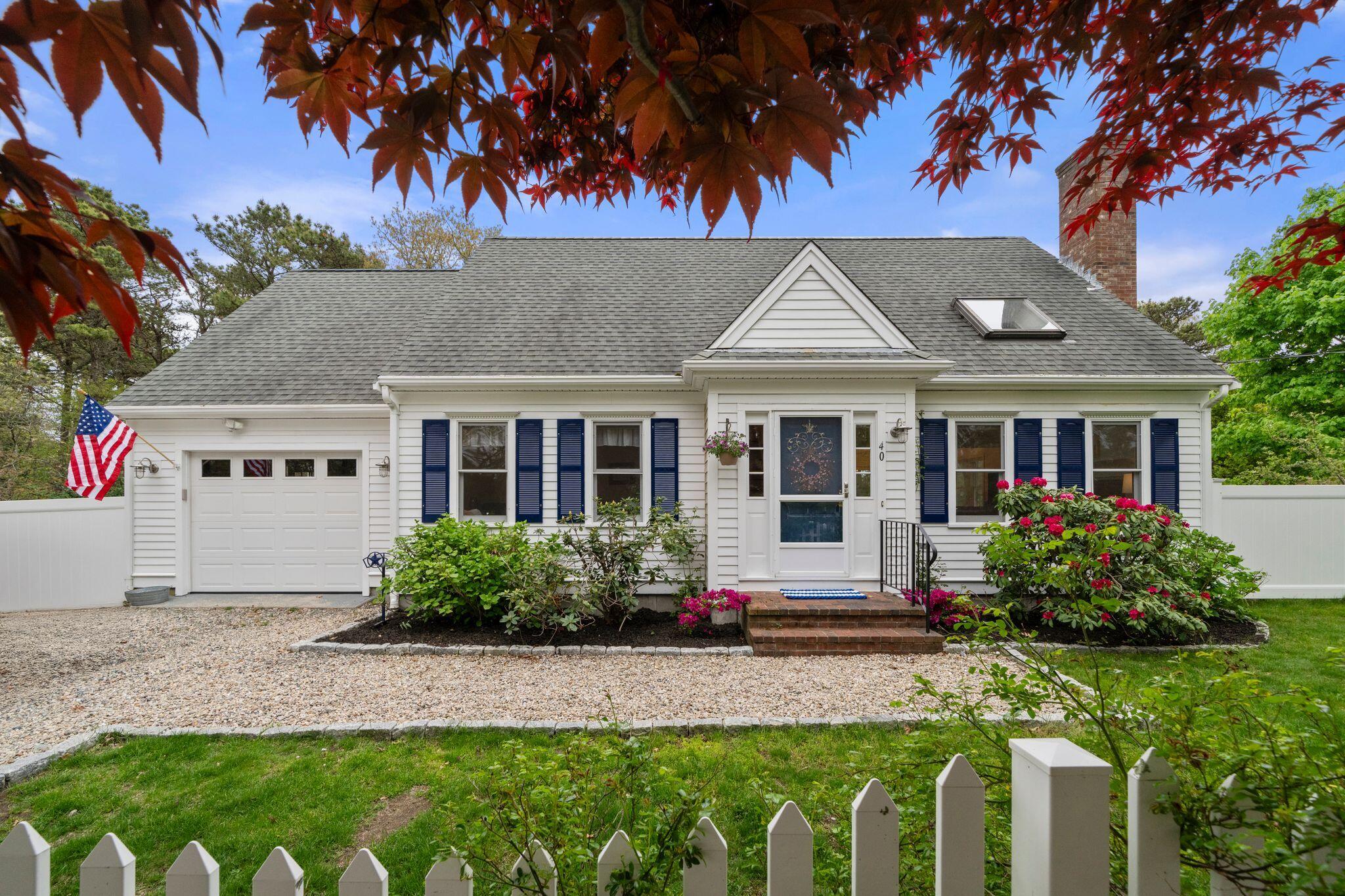 40 Sam Ryder Road Chatham, MA 02633 - Photo 1 of 42 a front view of a house with a garden