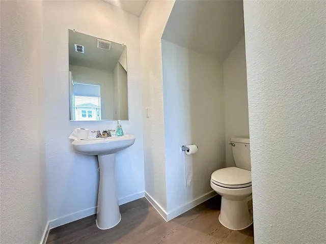 a bathroom with a sink toilet