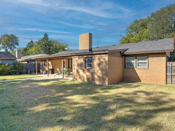 4509 62nd Street Lubbock, TX 79414 - Photo 19 of 20 a view of a house with backyard and a tree
