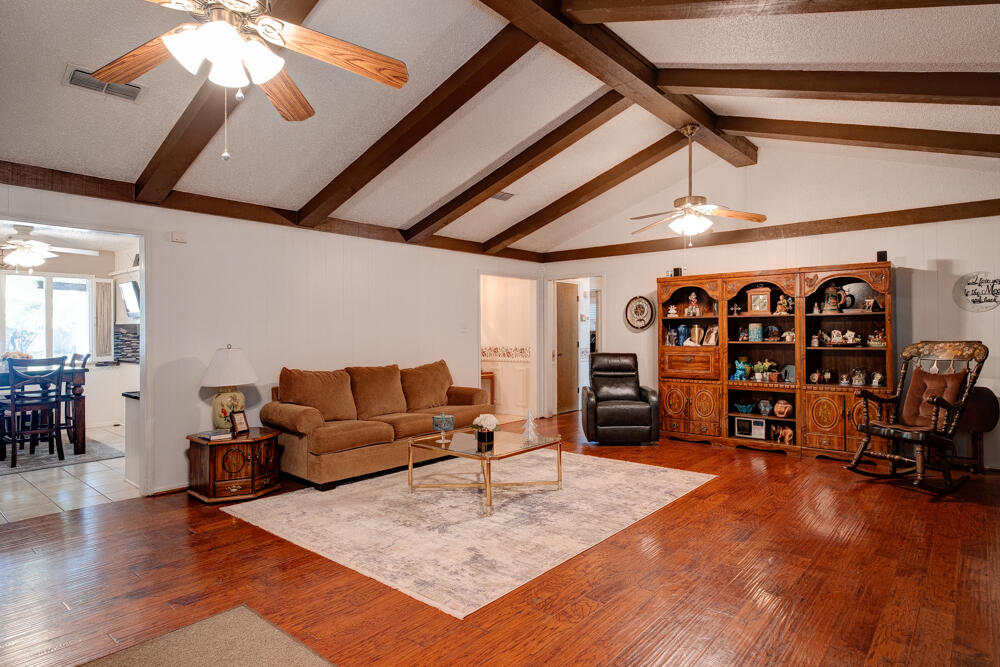 4509 62nd Street Lubbock, TX 79414 - Photo 5 of 20 a living room with furniture a ceiling fan and a rug