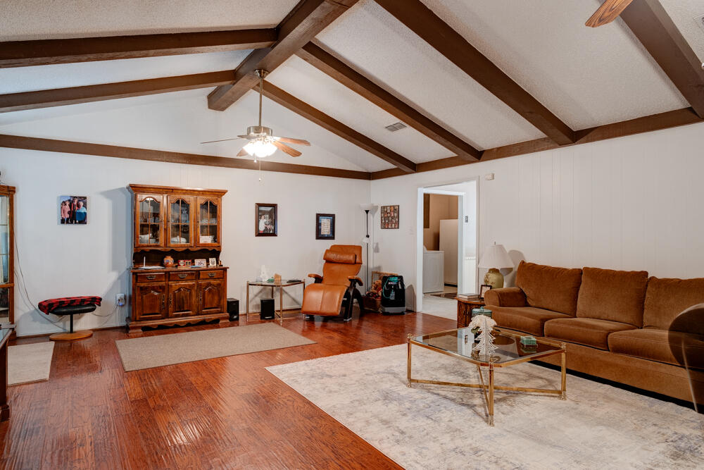 4509 62nd Street Lubbock, TX 79414 - Photo 6 of 20 a living room with furniture and wooden floor