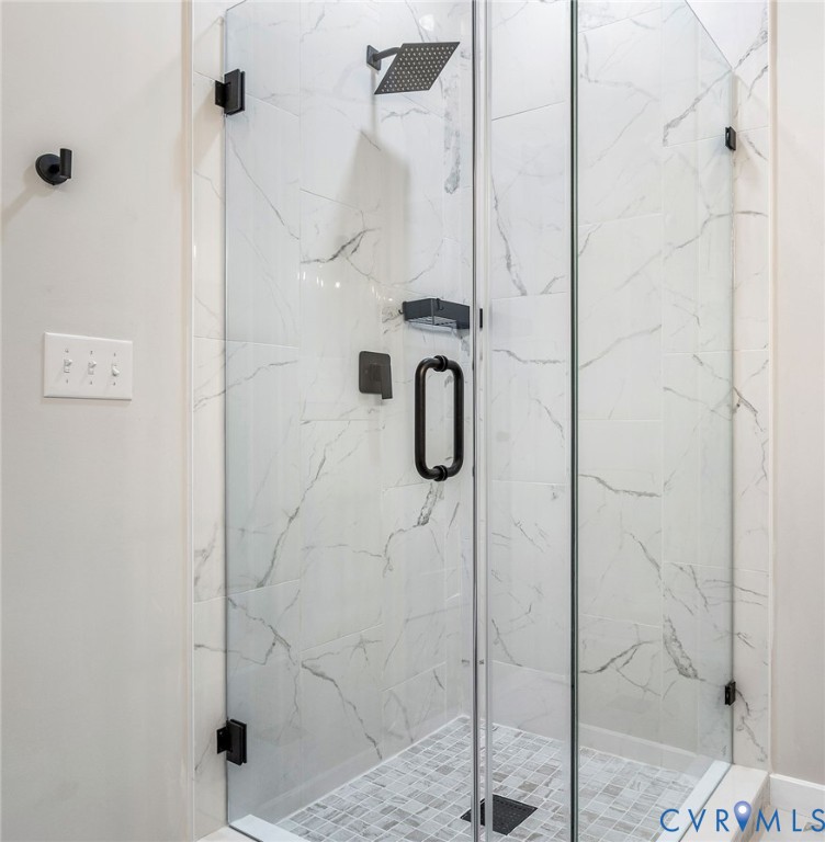 10601 Beaver Bridge Road Chesterfield, VA 23838 - Photo 31 of 39 Glass-enclosed shower featuring large format white