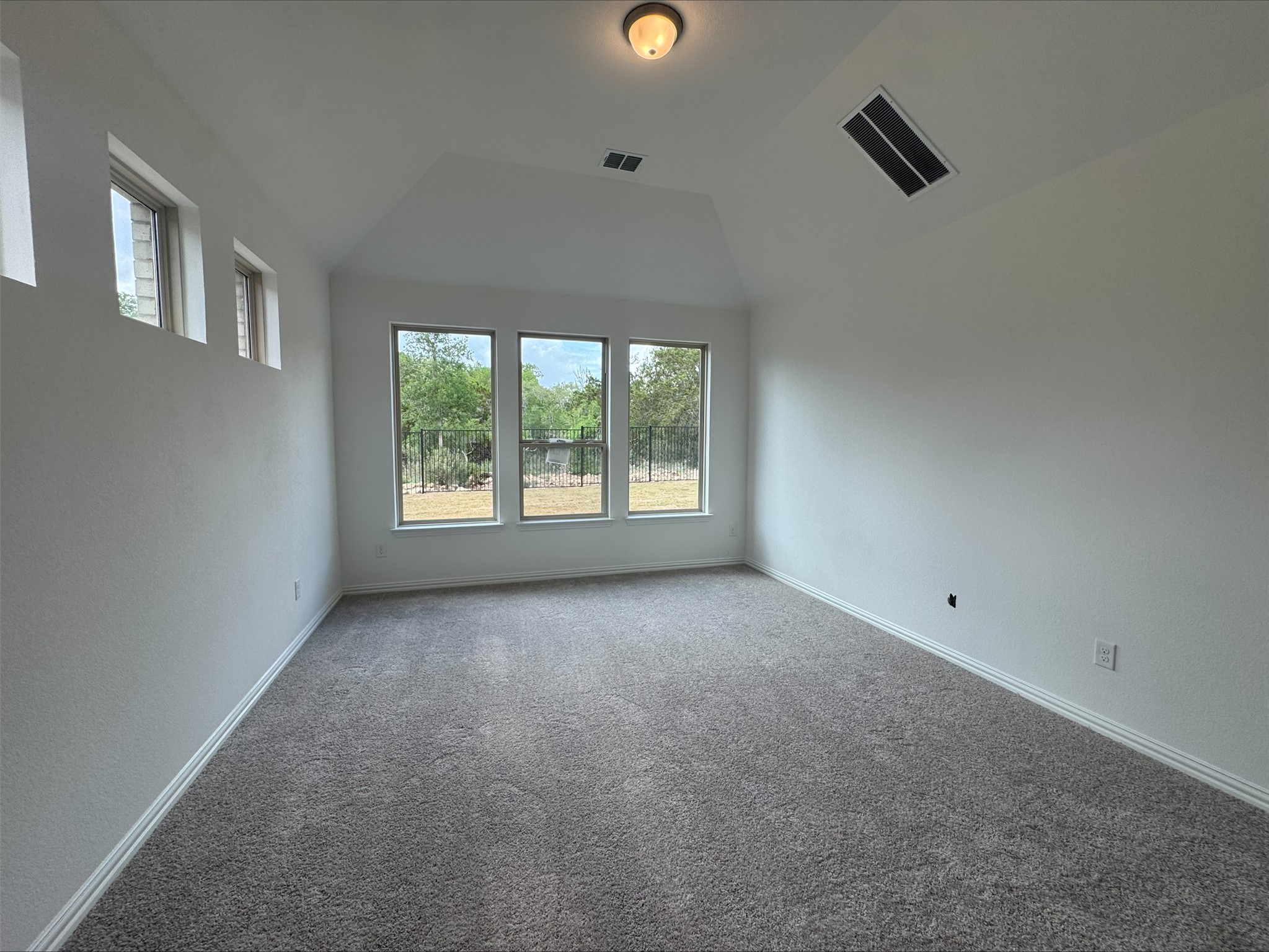 548 Tubman Drive Kyle, TX 78640 - Photo 10 of 13 an empty room with windows and entrance