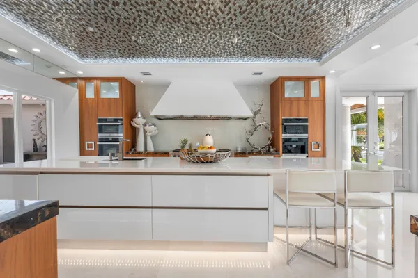 a spacious bedroom with a bed and a lamp