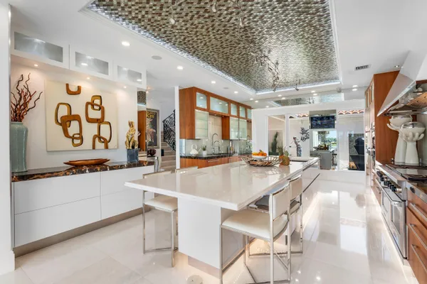 a front view of a house with garden and patio