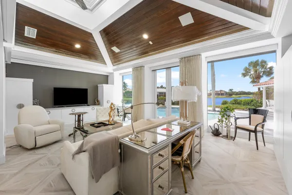 a view of a livingroom with furniture and a potted plant