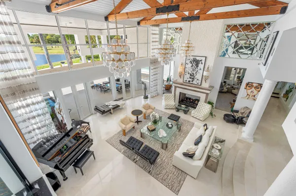 a front view of a house with a yard and a garden