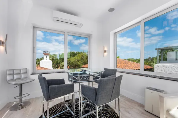an aerial view of a house with a yard and garden