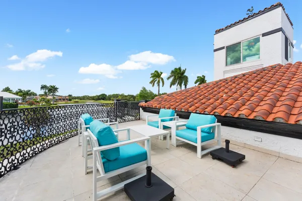 a view of a lake with a house swimming pool and outdoor space