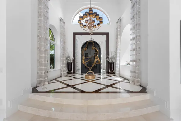 a kitchen with stainless steel appliances granite countertop a stove and cabinets