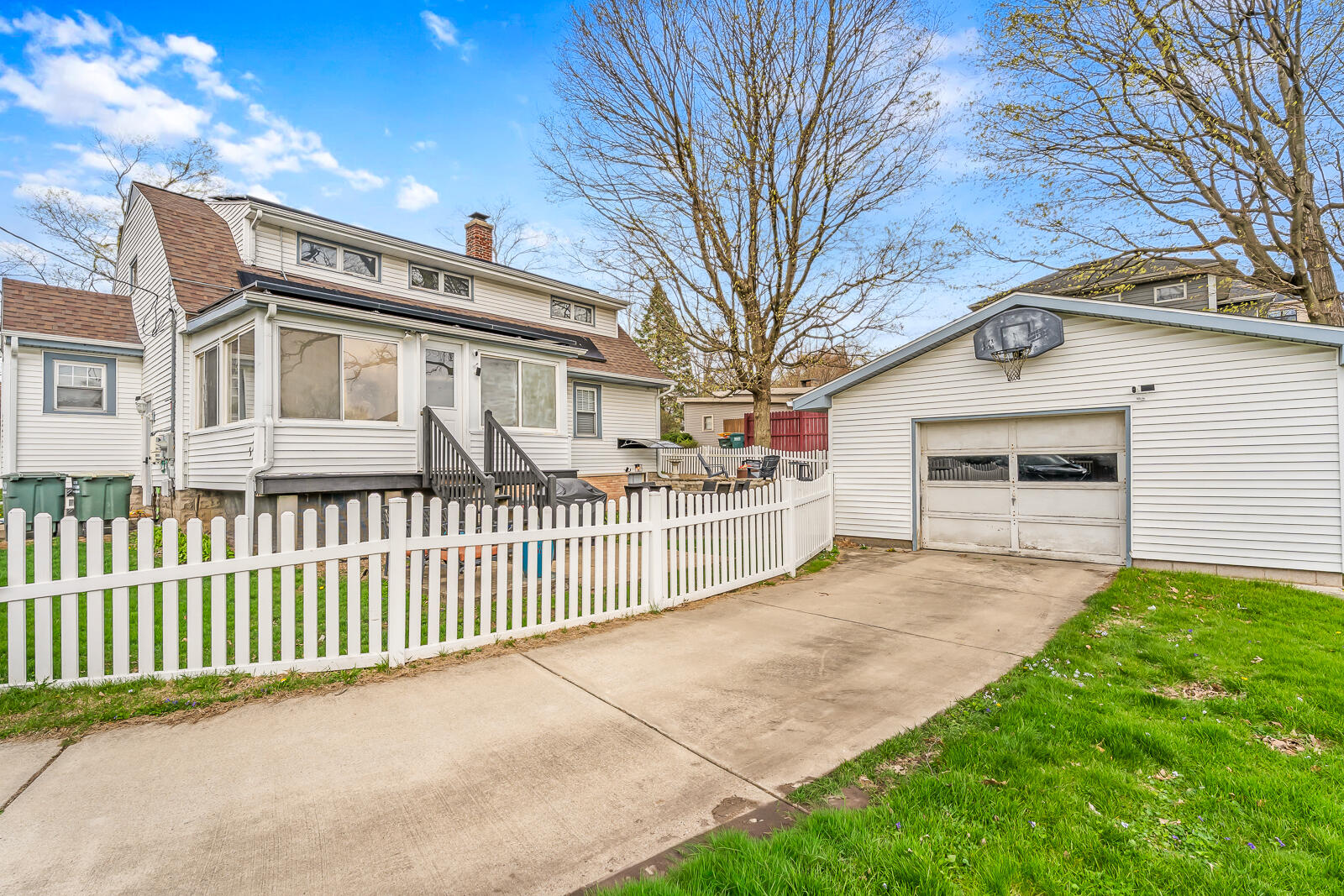 453 Chestnut Street Valparaiso, IN 46385 - Photo 46 of 47 a front view of a house with a garden and trees