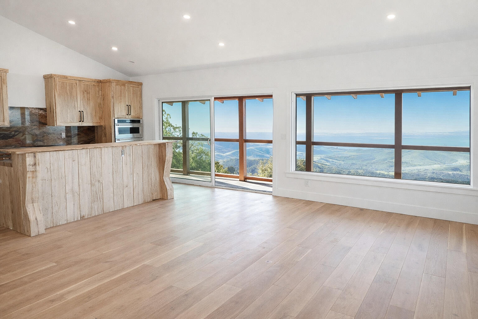 2111 Refugio Road Goleta, CA 93117 - Photo 5 of 22 a view of an empty room with wooden floor and a window