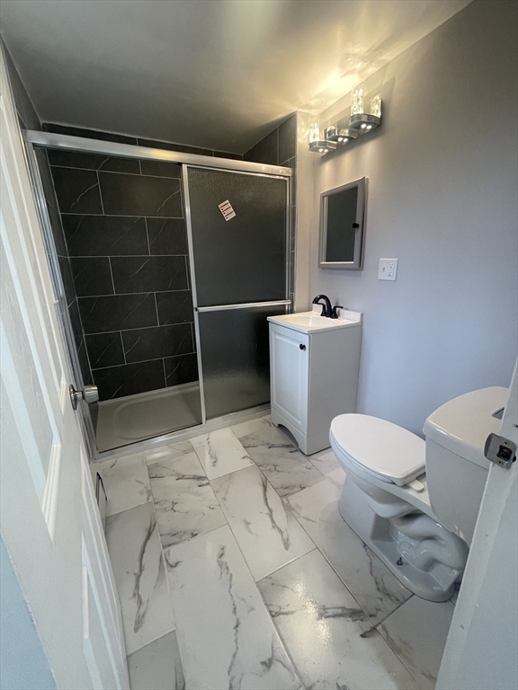 59 High Street Warren, MA 01083 - Photo 29 of 42 a bathroom with a toilet sink and shower