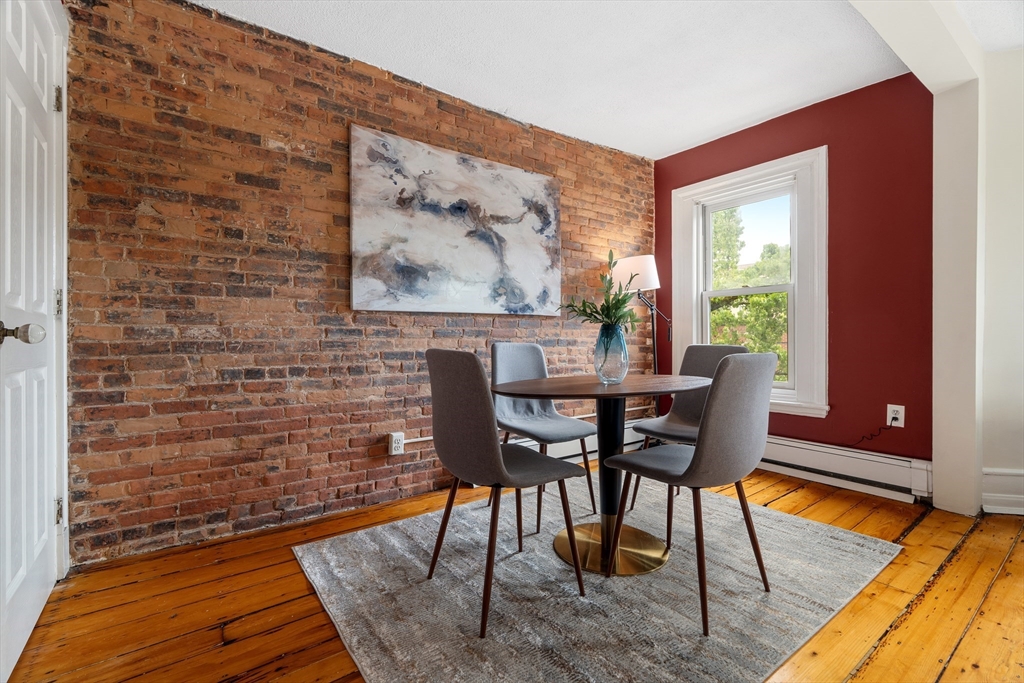 88 West Springfield Street, Unit 3 Boston, MA 02118 - Photo 7 of 17 a view of a dining room with furniture and wooden floor