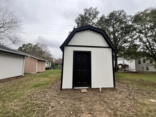 a house with trees in the background
