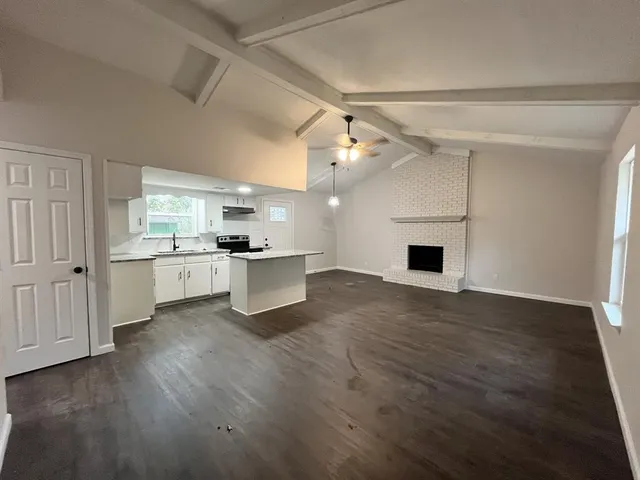 a view of kitchen with sink and wooden floor