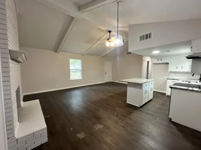 a large room with wooden floor