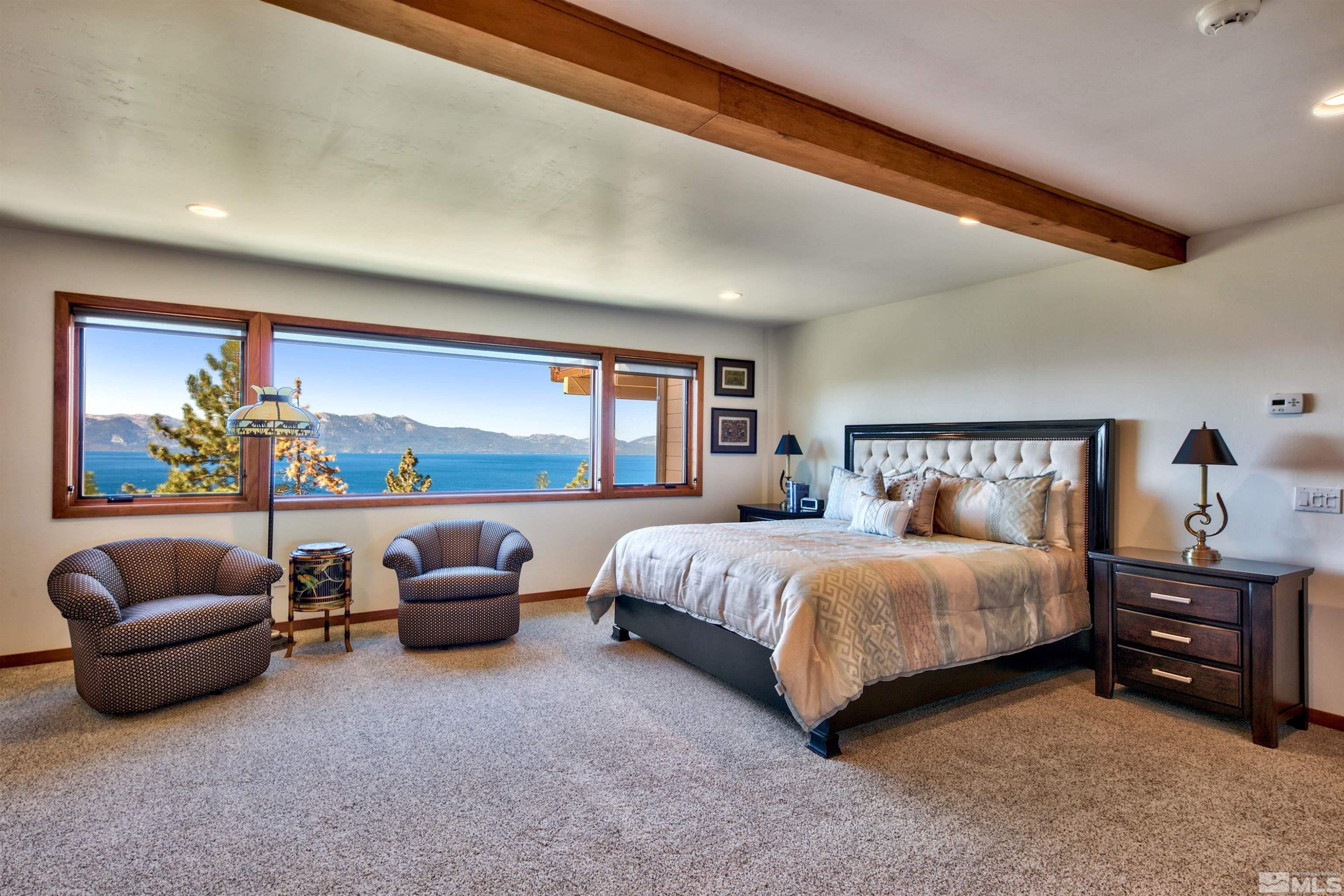 319 Pheasant Drive Glenbrook, NV 89413 - Photo 26 of 40 a spacious bedroom with a bed and couch