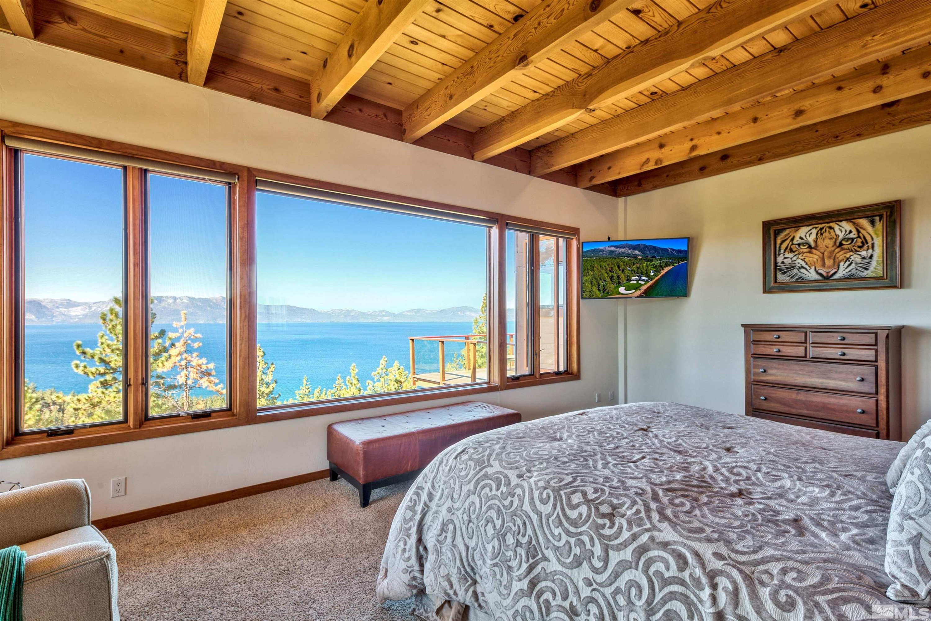 319 Pheasant Drive Glenbrook, NV 89413 - Photo 33 of 40 a bedroom with a bed and a large window with the outer view