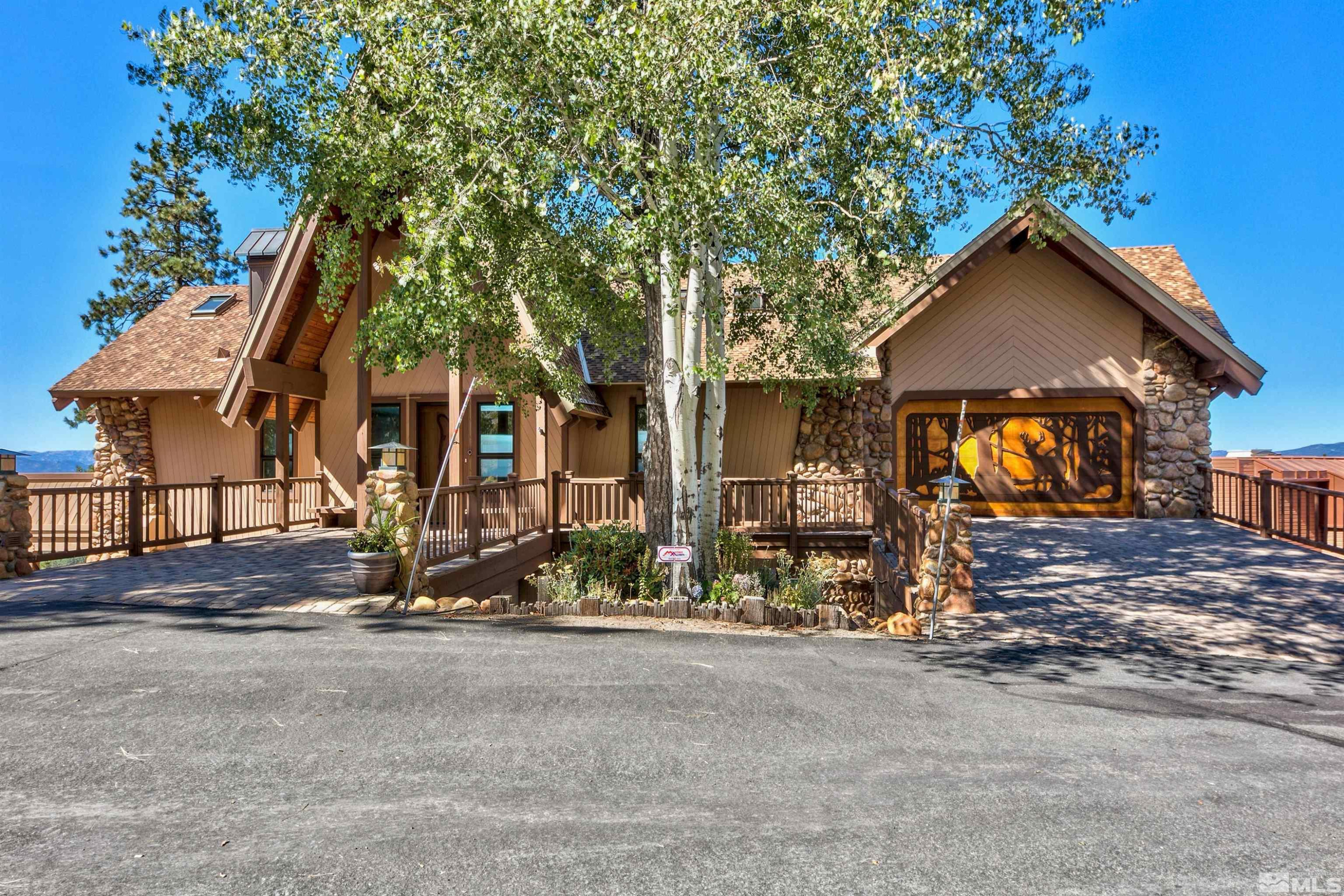 319 Pheasant Drive Glenbrook, NV 89413 - Photo 35 of 40 a view of a house with a yard and tree s