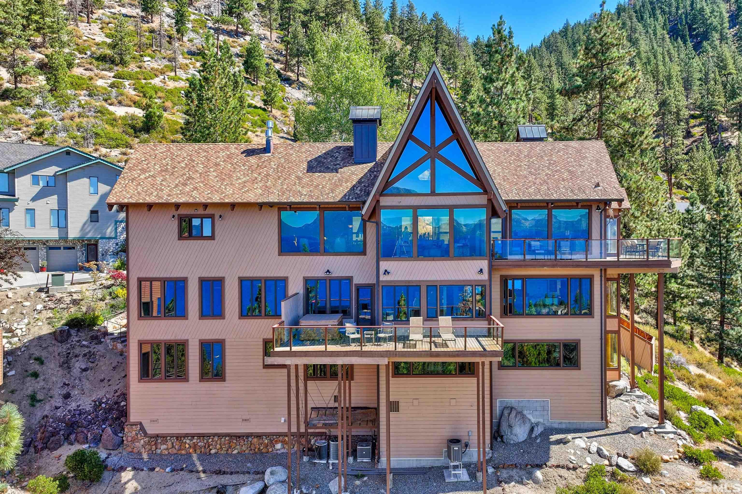 319 Pheasant Drive Glenbrook, NV 89413 - Photo 36 of 40 a front view of a residential apartment building with balcony and retail shops