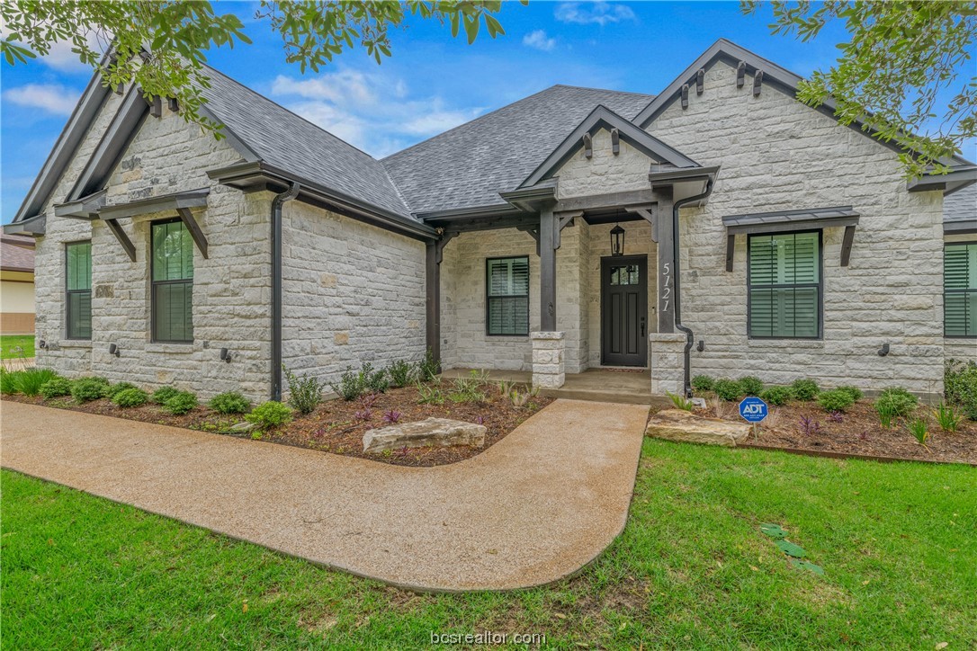 5121 Inverness Drive Bryan, TX 77802 - Photo 1 of 1 a front view of a house with garden