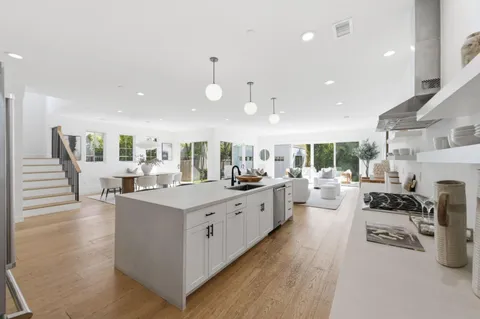 a kitchen with stainless steel appliances granite countertop lots of counter top space