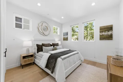 a bedroom with bed and a window