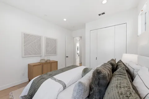 a bed room with a bed and a closet