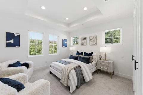 a bedroom with bed and a window