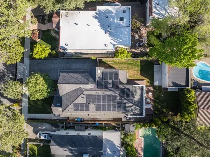 an aerial view of a residential apartment building with a yard