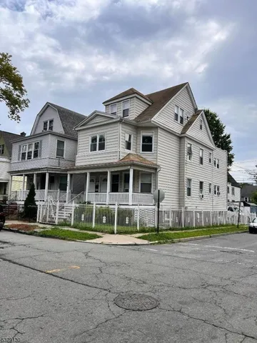 a front view of building with yard