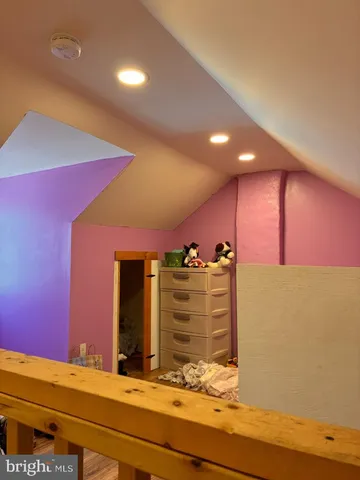 a view of room with a ceiling fan