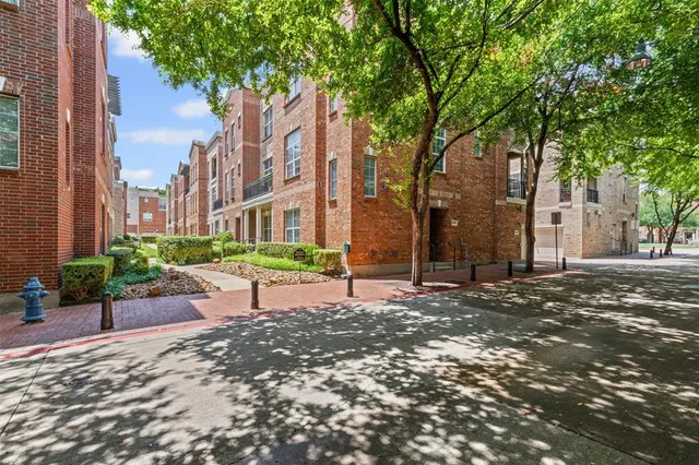 a view of a backyard with large trees