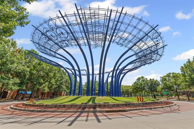 a row of palm trees in front of house