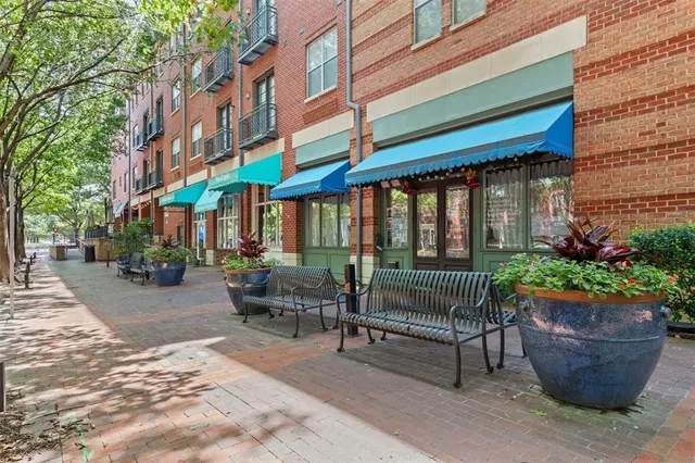 a view of a park with sitting area