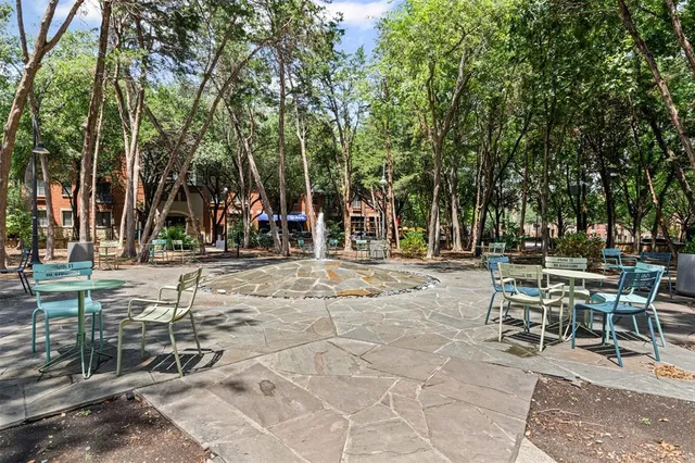 a front view of a building with trees