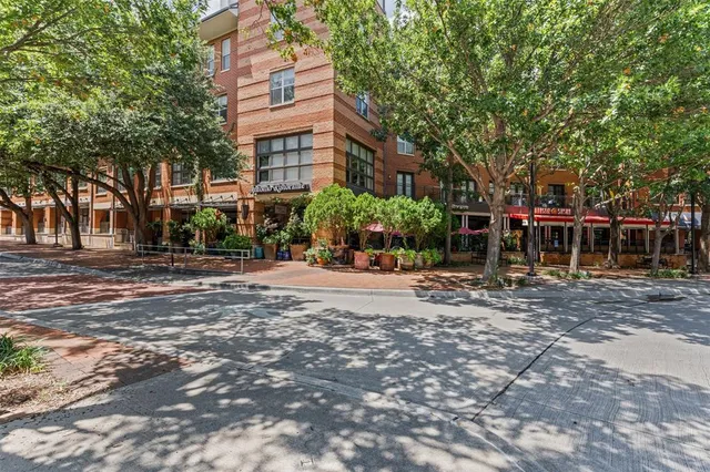 a view of street with tall buildings