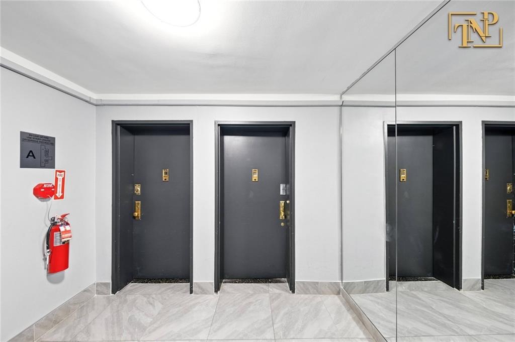 1190 East 53rd Street, Unit 5B Brooklyn, NY 11234 - Photo 12 of 15 a bedroom with a bed and wooden floor