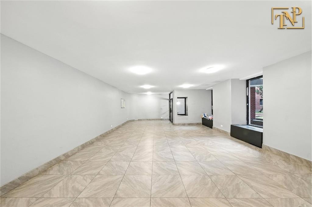 1190 East 53rd Street, Unit 5B Brooklyn, NY 11234 - Photo 13 of 15 a view of empty room with a fireplace