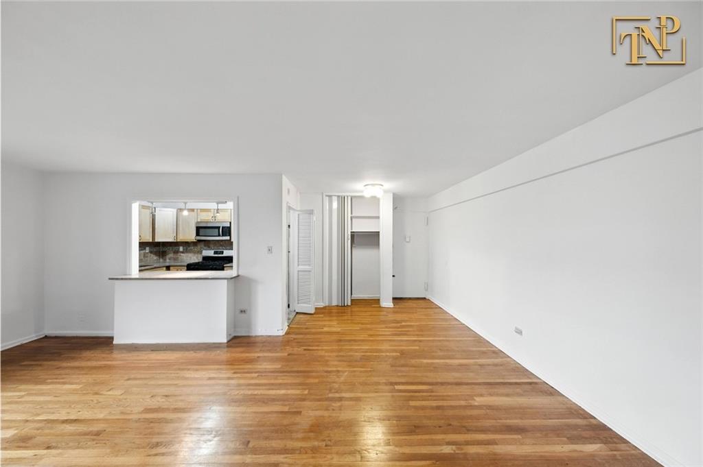 1190 East 53rd Street, Unit 5B Brooklyn, NY 11234 - Photo 4 of 15 a view of a kitchen with a sink and a refrigerator