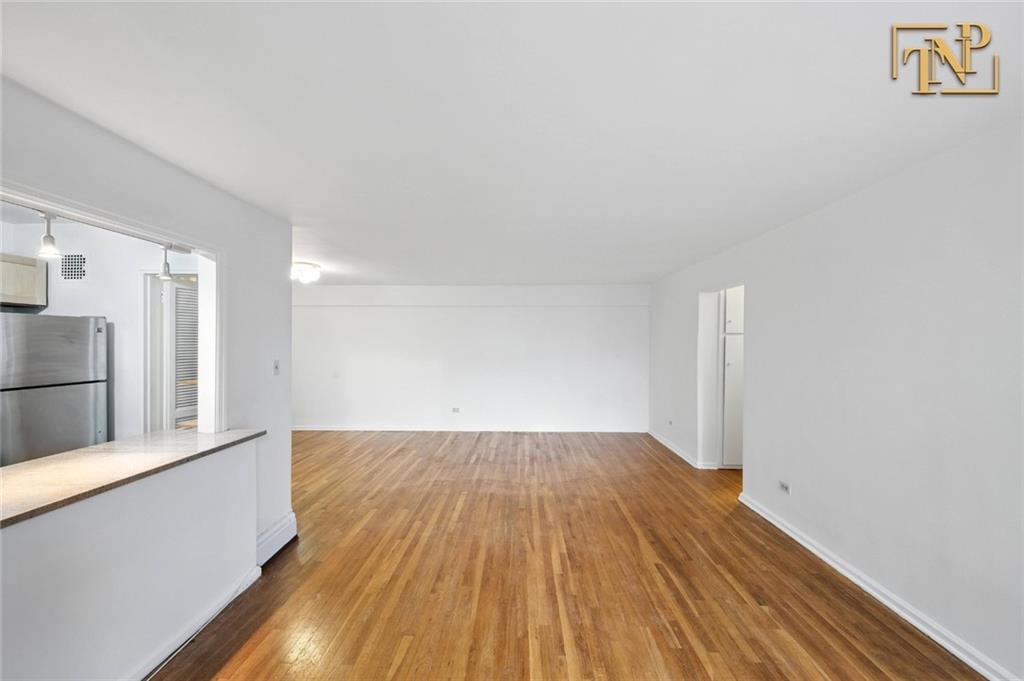 1190 East 53rd Street, Unit 5B Brooklyn, NY 11234 - Photo 5 of 15 a view of empty room with wooden floor