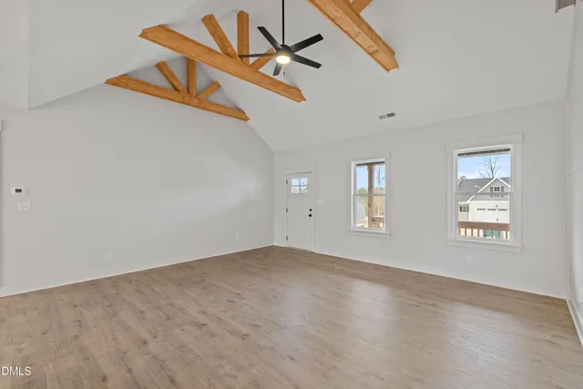 a view of a kitchen with a sink and cabinets